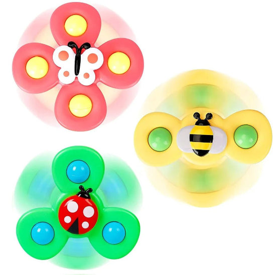 Spinner à Ventouse - Bébé jouet : Trois spinners en forme d'insectes - un papillon rose, une abeille jaune et une coccinelle verte - dotés chacun de trois bras et d'un motif circulaire. Idéal comme spinner bébé ou jouet sensoriel ; représenté sur fond blanc.